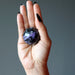 charoite sphere in hand
