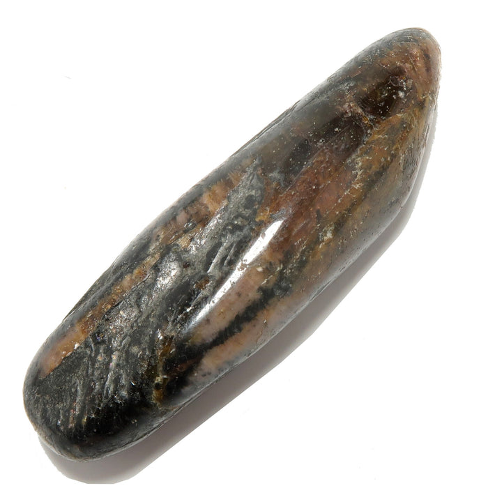 Polished chiastolite stone with brown and gray hues on a white background