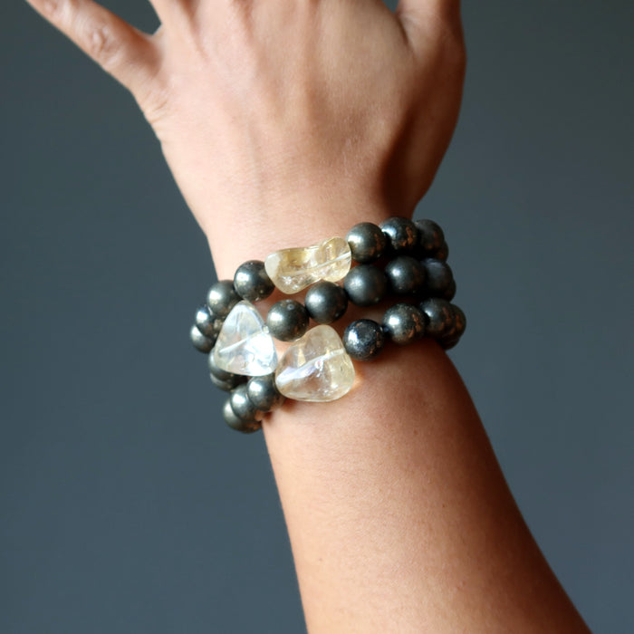 citrine and pyrite bracelets stacked on wrist