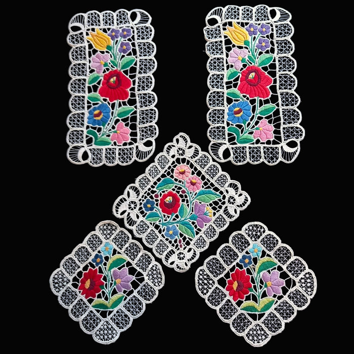 hungarian kolocsa Decorative lace doilies with floral patterns on a black background