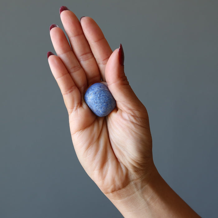 dumortierite tumbled stone in hand