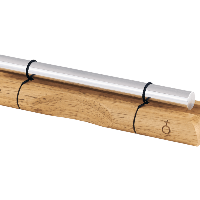 Wooden holder with a silver cylindrical object on a solid background