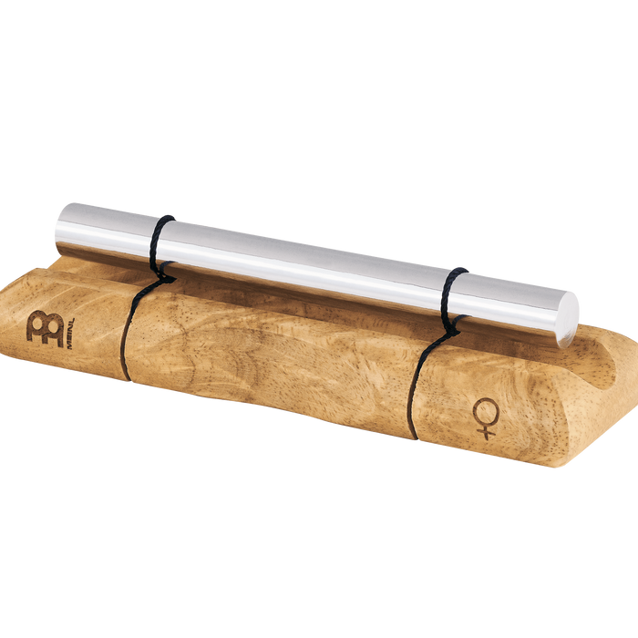 Wooden mallet with metal head on a dark green background