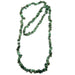 Green emerald stone necklace on a white background