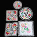Set of hungarian kalocsa embroidered doilies with floral patterns on a black background
