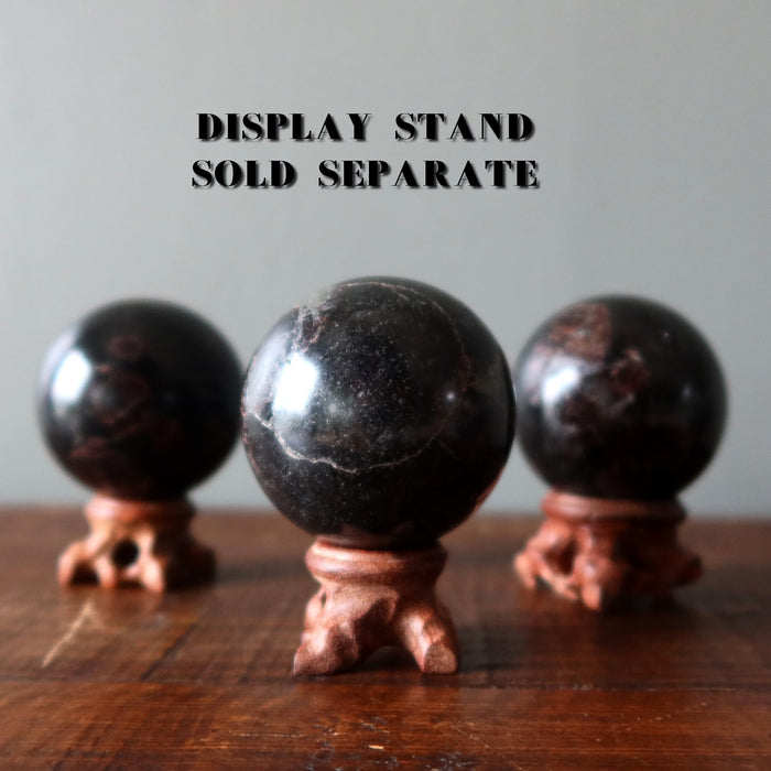 garnet in black balls on stands