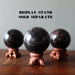garnet in black balls on stands