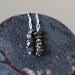 hematite earrings on hematite slab