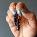 hand holding hematite earrings