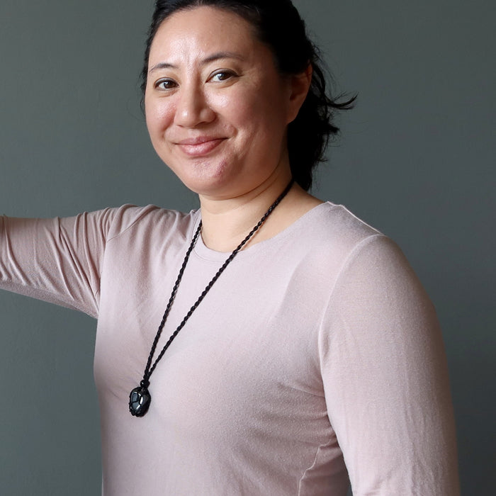 woman wearing hematite necklace