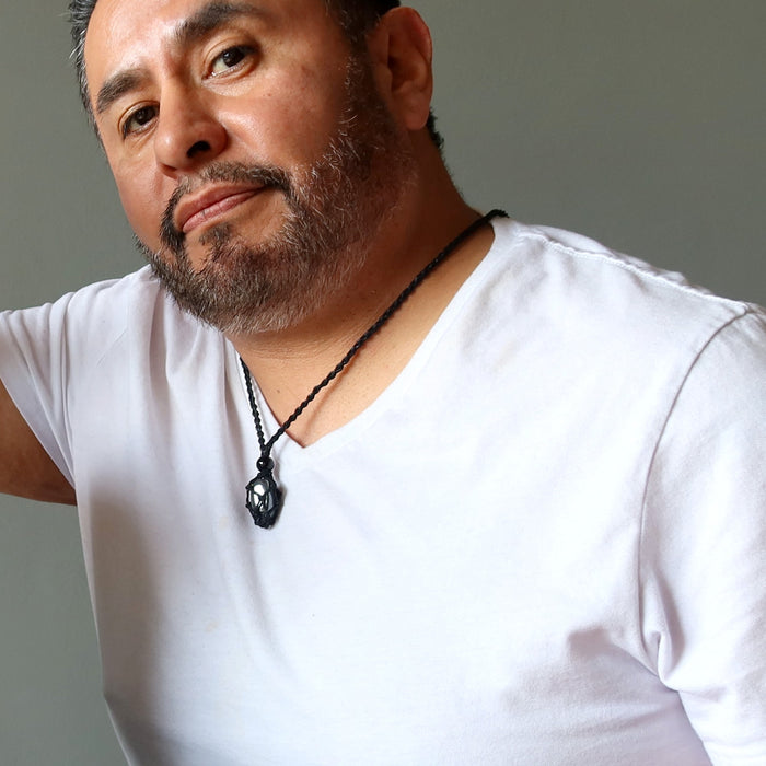 man wearing hematite necklace