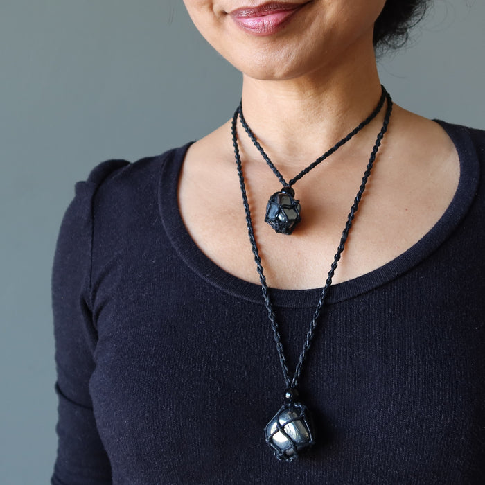 woman wearing hematite necklaces