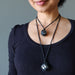 woman wearing hematite necklaces