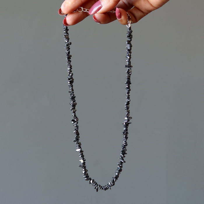 hand holding hematite chip necklace