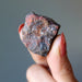 raw hematite cluster in hand