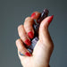 hematite red jasper tumbled stones in hand