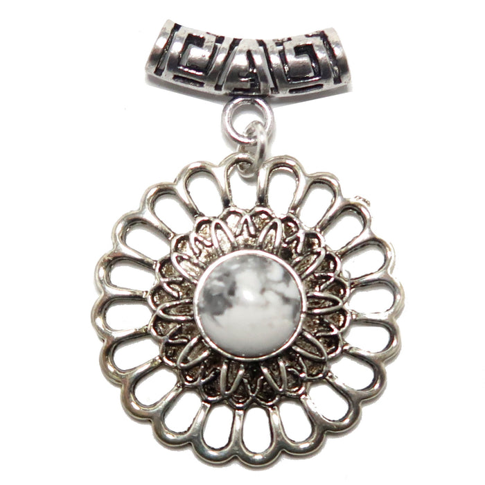 Silver floral Howlite pendant with a central gemstone on a white background