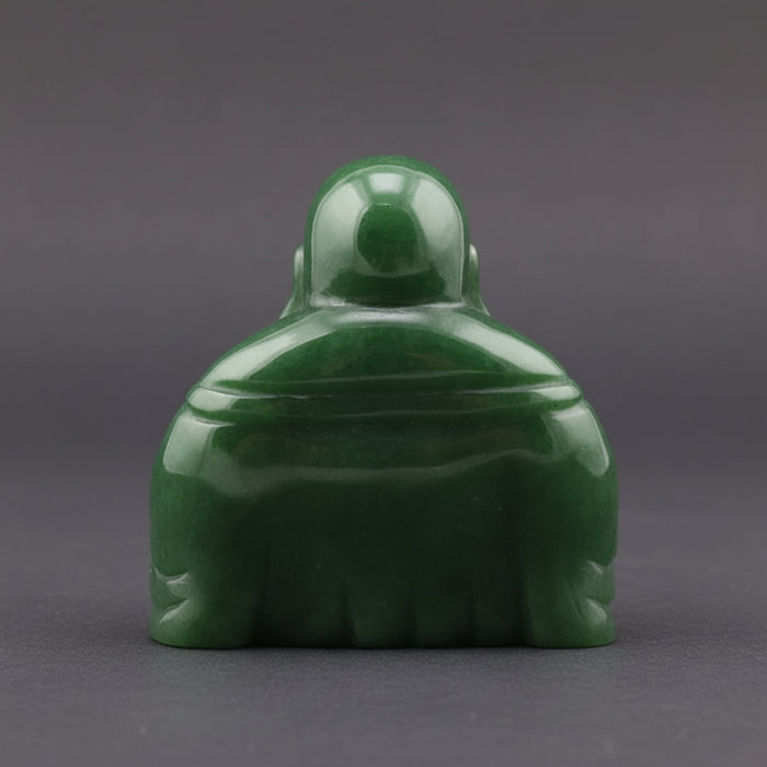 Green jade Buddha statue on a white background