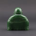 Green jade Buddha statue on a white background