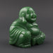 Green jade Buddha figurine on a white background