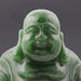 Green jade Buddha statue on a white background