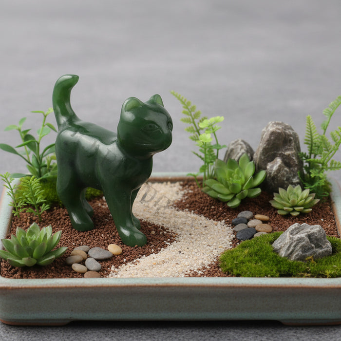 Green jade cat figurine on a white background