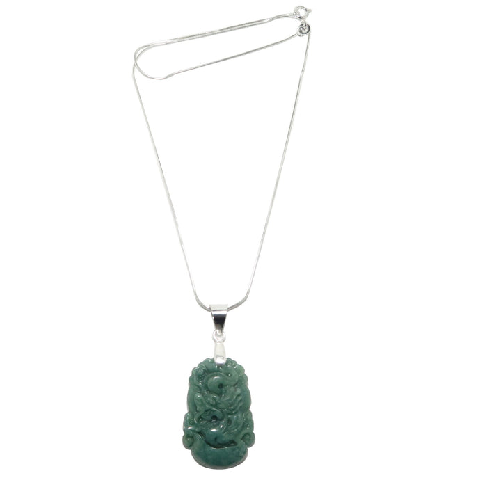 A sterling silver necklace with a green nephrite jade pendant carved in the shape of a dragon, attached to a snake chain.