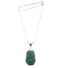 A sterling silver necklace with a green nephrite jade pendant carved in the shape of a dragon, attached to a snake chain.