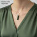 Green pendant necklace on a mannequin with green top
