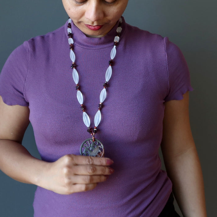 sheila of satin crystals wearing Dragon Medallion strung on frosted glass brown jasper and garnet beads necklace