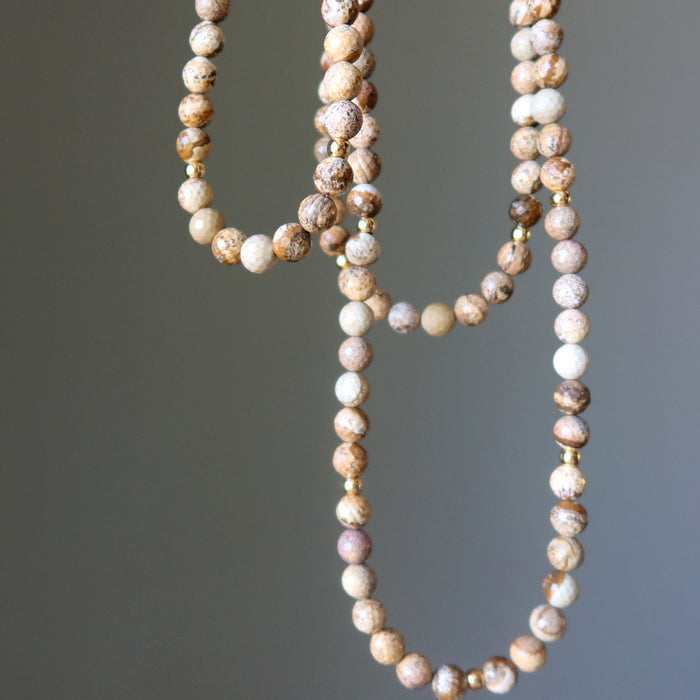 Beaded Landscape Jasper necklace with multicolored beads on a gray background