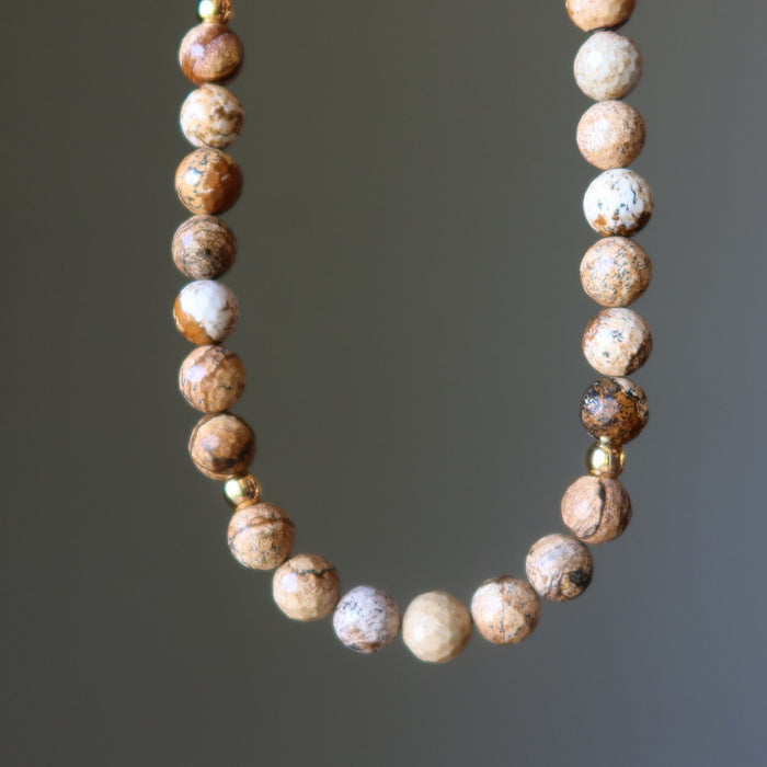 Landscape Jasper necklace with round beads on a gray background