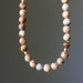 Landscape Jasper necklace with round beads on a gray background