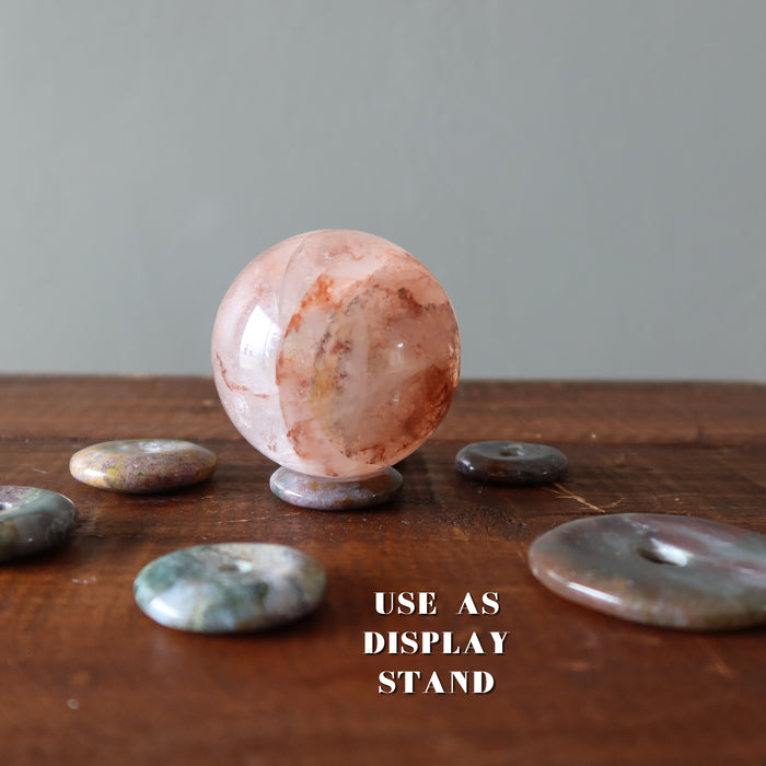 jasper gemstone donut used as a stand for a quartz sphere