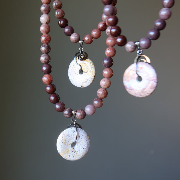 Necklaces with purple aventurine beads and a round jasper pendant