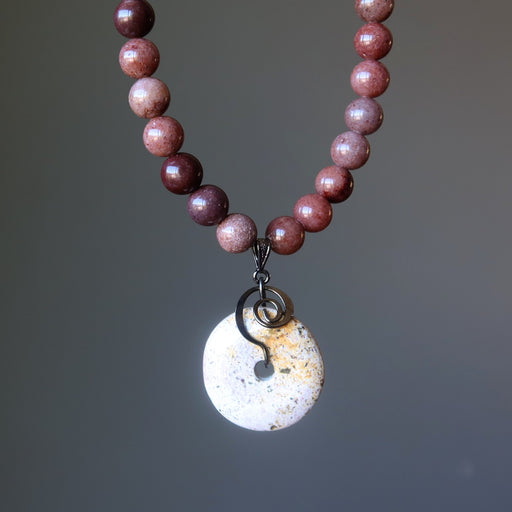 Necklace with purple aventurine beads and a round jasper pendant