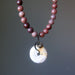 Necklace with purple aventurine beads and a round jasper pendant