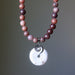 Necklace with purple aventurine beads and a round jasper pendant