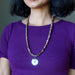 Necklace with purple aventurine beads and a round jasper pendant