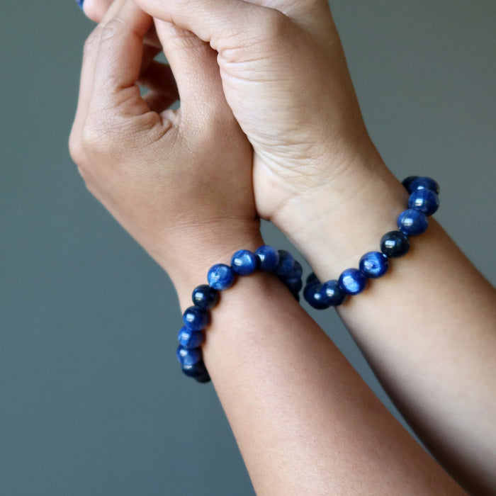 kyanite bracelets on hands