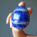 hand holding lapis lazuli egg