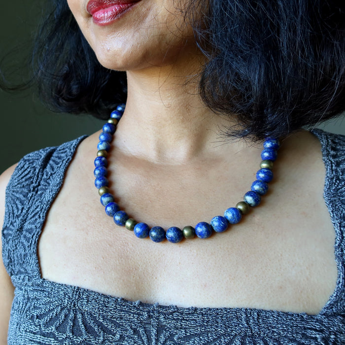 Close-up of a person wearing a Lapis Lazuli necklace 