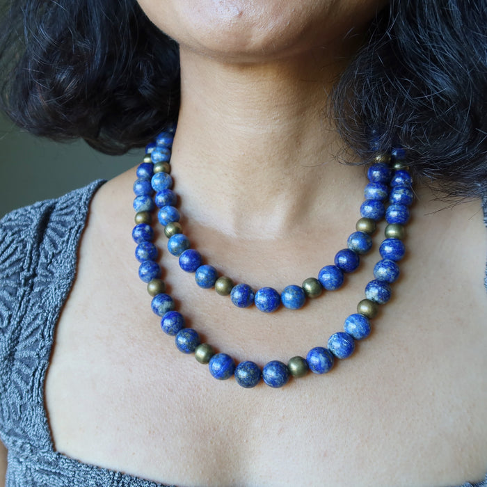 Person wearing a blue Lapis Lazuli necklace 