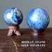 two denim lapis sphere on display stands