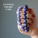dark lepidolite bracelets on hands