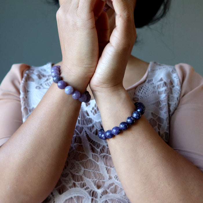 lepidolite bracelets on hands