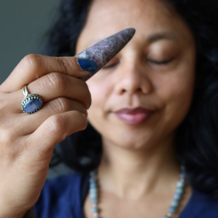 lepidolite massage wand at third eye chakra
