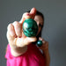 woman holding malachite eggs