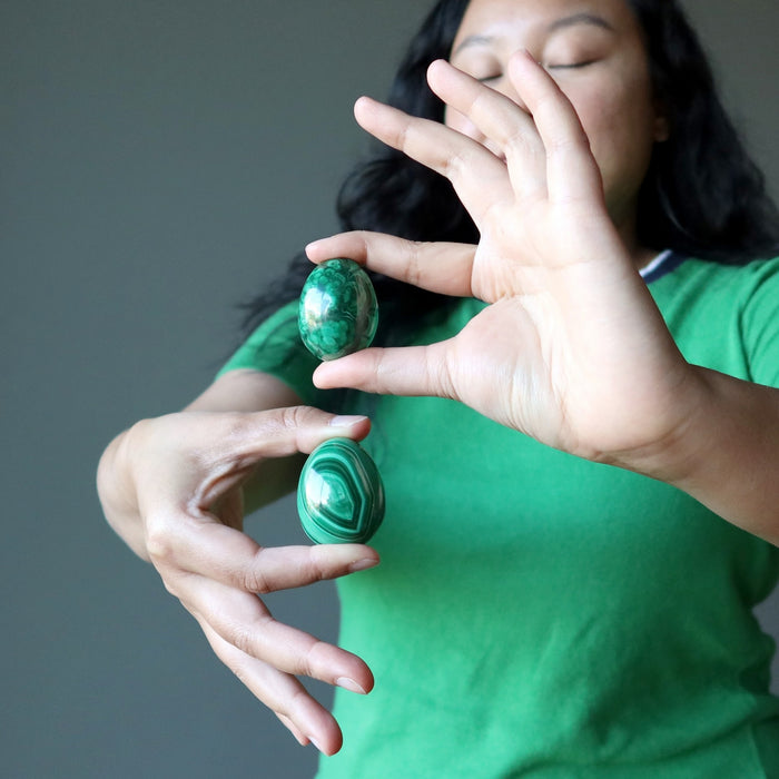 woman holding malachite eggs