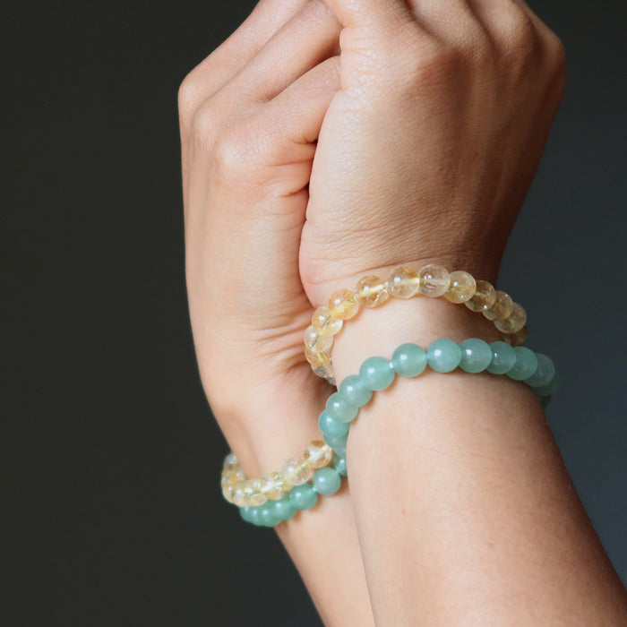 citrine and aventurine bracelet set on wrists